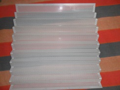 Corrugated perforated plastic sheet